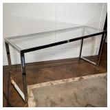 CHROME & GLASS CONSOLE TABLE | Appearing in very good condition; h. 27 x w. 60 x d. 19 in. 