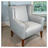 BLUE UPHOLSTERED ARMCHAIR | Winged side chair in a light blue tweed-like upholstery, on square taper