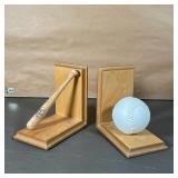 BASEBALL BOOKENDS | One bookend with a miniature Louisville Slugger, the other with a baseball