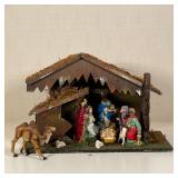 ITALIAN NATIVITY SCENE | Decorative Christmas / nativity scene, with multiple figural pieces; h. 11 