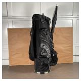 CALLAWAY GOLF BAG | Black golf bag with misc. gloves, balls, and Drizzlestik umbrella 