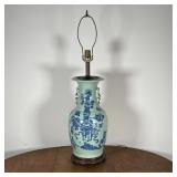 BLUE PAINTED CELADON LAMP | With flower pots and other decorations on a celadon color background