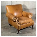 Edwardian style chair with pleated roll arms outlined with nailheads, caster feet in espresso finish