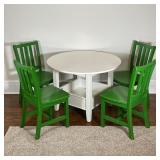 CRATE & BARREL Land of Nod | white "bin table" having a round top over an open shelf