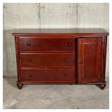 SOLID WOOD DRESSER | Three stacked drawers flanked by a side cabinet, with some carved accents