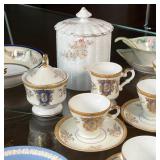 three painted items, to mounted bud vases (one detached), and a Bavarian china cylindrical box