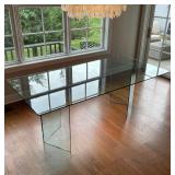 MODERN GLASS DINING TABLE | Tempered glass top, with L-shaped supports and a rectangular top