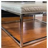Having a white leather wrapped cushioned top with chrome tacks over a square chrome frame; h. 18-1/2