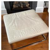 MITCHELL GOLD + BOB WILLIAMS LOW TABLE | leather wrapped top on a chrome frame; h. 18-1/2 x 43 x 43