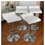 CHROME TELESCOPING BARSTOOLS | A set of four bar stools, having chrome frames with white faux-leathe
