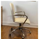 beige fabric upholstered seat and backrest, with chrome armrests; on casters; h. 35 x 25 x 24 in.