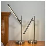 brushed aluminum, each with a USB port on the base for charging devices