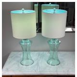 PAIR GREEN GLASS LAMPS | Open "hurricane shade" form bases, excellent condition; h. 25 x dia. 10 in.