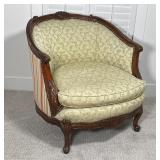 BARREL BACK SLIPPER CHAIR | the crestrail and arms with extensive carvings; 32 x 31 x 34 in.