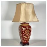 CERAMIC JAR TABLE LAMP | Ceramic jar lamp base with penwork design over wooden base with tan fabric 