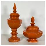 PAIR ORANGE CERAMIC JARS | With finial lids; h. 16 in. taller