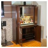 drawers, and cubby holes, magnetic closure activated lights and hide-away pocked doors; 77 x 48 x 19