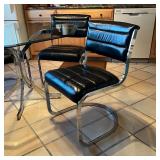 metal cantilever dining chairs with black leather upholstery, stamped "Cal Style Furniture Mfg Co"