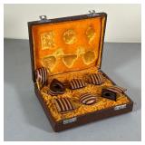 SET KEEPSAKE BOXES | A faux reptile skin case containing six miniature lidded wood boxes designed in