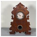 AMERICAN SHELF CLOCK | Time & strike, 30 hr, iron front style but made in wood, with carved motifs, 