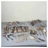 LARGE LOT SILVERPLATE FLATWARE | Various silver-plated utensils, including a matching set of spoons,