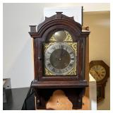 MOUNTED CLOCK HEAD | Gilt scrollwork accents surrounding the face, with Roman numeral markers; h. 19