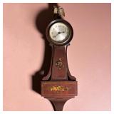 SETH THOMAS MINIATURE BANJO CLOCK | By Seth Thomas Clock Co., wooden case, with floral decals on the