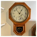 OCTAGONAL WALL CLOCK | Seth Thomas, having a round face with Arabic numeral markers in a wood case w