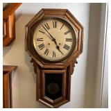 LONG DROP OCTAGON CLOCK | Ansonia Clock Co. long drop octagonal clock, having a round face with Roma