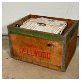 CRATE WITH VINTAGE BULLETINS | Vintage wooden milk crate with metal hardware that reads "Property of