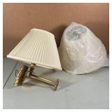 PAIR BRASS WALL SCONCES | Articulating brass arms, single lights each with a ribbed white shade; h. 