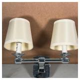 DOUBLE LIGHT WALL SCONCE | Having a chrome base with two lights, each with a lampshade; h. 13 x w. 1
