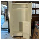 brass handles, the interior with three adjustable shelves, one fixed shelf at the top and a place fo