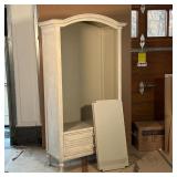 three open adjustable shelves over two full-width drawers, with a carved arch top and carved decorat