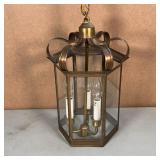 made in the United States, having an antique brass finish with "laced" trim, having three lights wit