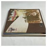 The Eagles self-titled album (1972) [sleeve separated on one edge]; and Led Zeppelin II (1969) [the 