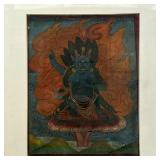 THANGKA PAINTING | Small thangka painting matted and framed showing a blue god seated before flames;