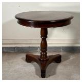 ANTIQUE PEDESTAL TABLE | Having a round table top over a turned pedestal base raised on a tripod pla