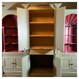 cove bookshelves, over three banks of lower double cabinet doors. Reeded bands, quarter columns, she