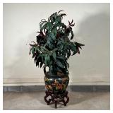 BLACK PAINTED JARDINIERE | Planter decorated with birds among flowers, with a faux plant, both appea