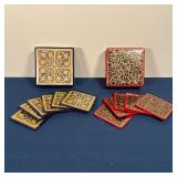TWO COASTER SETS | Two sets of lacquered decorated coasters (including one set of 5 with red borders