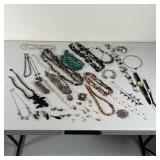 COSTUME JEWELRY & WATCHES | A group of beaded necklaces, bracelets, earrings, and watches, including