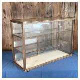 GLASS DISPLAY CABINET | Countertop display cabinet having a metal frame with sliding glass doors and