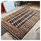 BLUE BOKHARA RUG | Hand loomed; 9 ft. 7 in. x 6 ft. 4 in.