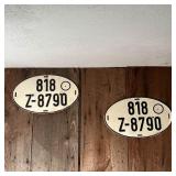 (2pc) EARLY LICENSE PLATES | A matching pair of oval license plates; each 8-1/2 x 14 in.