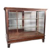 CARVED WOOD DISPLAY CASE | With glass panels, textured glass shelves, and sliding back doors; h. 39-