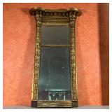 GILT PIER MIRROR | With two mirrored panels in a gilt carved frame; h. 43-1/4 x w. 25-1/2 x d. 5-1/2