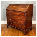 ANTIQUE SLANT LID DESK | Drop front reveals a fitted interior over four full width drawers [escutche