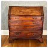 ANTIQUE SLANT LID DESK | Drop front reveals a fitted interior over four full width drawers [escutche