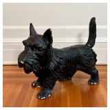 PAINTED DOG FIGURE | Small black schnauzer, black painted composition; h. 14-3/4 x w. 18-1/2 x d. 8 